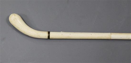 A 19th century turned and carved ivory walking stick, 35in.